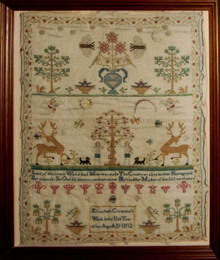 A framed sampler signed Elizabeth Crowther, 1812. With flowers, insects, birds above Adam and Eve with the Tree of Knowledge; with religious text, a row of various crowns with the initial letters of their rank, and a floral border.