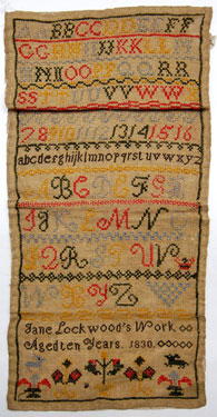 An unframed sampler signed Jane Lockwood, aged 10, 1830; alphabet and numbers in cross stitch.