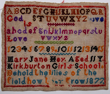 An unframed needlework sampler, signed Mary Jane Hey, aged 11, 1877;  Kirkburton Girl's School, Huddersfield, West Yorkshire; alphabet, numbers and religious text.