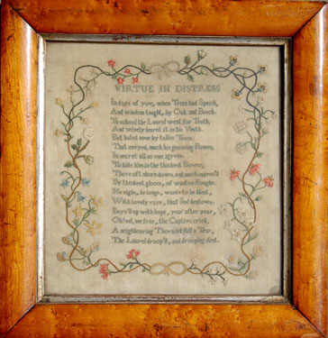 A framed sampler, consisting of poetic verse 'Virtue in Distress' and floral border; embroiderer unknown.