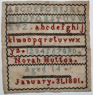 An unframed sampler signed Norah Hutton aged 14, January 31 1881. Alphabet and numbers