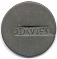 View: ka00027 A bronze halfpenny coin which has been polished on both sides in order to produce a love token; on one side the name D. Davies has been stamped, the other side has been left blank.