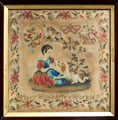 View: ksp00001 A framed sampler signed Mary Hinchliffe; it depicts a girl with a small dog. It belonged to a woman who was drowned in the 1944 Whitsuntide Holmfirth Flood, and was purchased in the sale of her effects. The two women who died in the flood were Miss Maud Wimpenny and Mrs D Schofield.