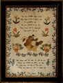 View: ksp00010 A framed sampler signed by Ann Chapman 1821. Central motifs of fruit bowl, flowers with trailing floral border and moral text.