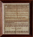 View: ksp00022 A framed sampler signed Fanny Caroline Chaplin, 1845. Alphabet and lettersm small leaf border at bottom.