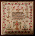View: ksp00028 A framed sampler signed Mary Barraclough of West Ardsley near Wakefield, West Yorkshire, 1837. Elaborate design, religious motto, birds butterflies, flowers, two maidens surrounded by flower border.
