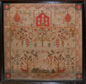 View: ksp00047 A framed sampler signed Mary Teasdale 1863. Elaborate design including stag, deer, trees, flowers, butterfly, birds and squirrels.