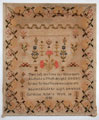 View: ksp00054 A mounted but unframed sampler, made by Caroline Riley in 1848; with religious text and alphabet, with floral motifs above and a 'honeysuckle' border.