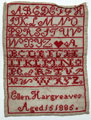 View: ksp00060 An unframed sampler signed Ellen Hargreaves, aged 15, 1885, in cross stitch with alphabet, heart and inscription.